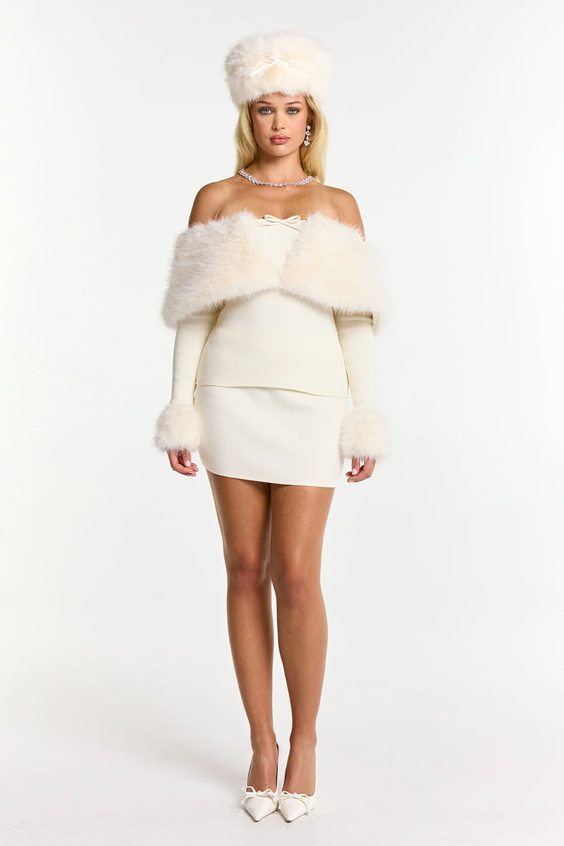 Nana Jacqueline Nadine Top in a stylish, fitted design with a v-neck and long sleeves, shown in a neutral color.