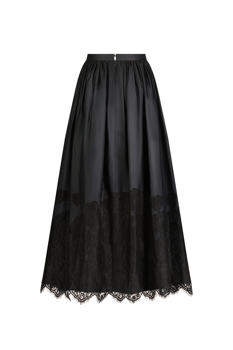 Black Fiorella maxi skirt by Scarlett Gasque, flowing design with a comfortable waistband, shown in a stylish fashion image.