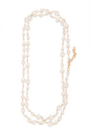Silver Aura Pearl Necklace by Silvia Gnecchi featuring elegant white pearls on a delicate chain.