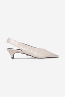 Ivory Downtown Heels by 10th Floor featuring sleek stiletto design and elegant ankle straps, perfect for stylish occasions.
