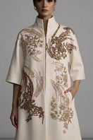 Ivory Belle Epoque coat by Nadya Shah, stylish and elegant outerwear with intricate detailing, shown on a model.