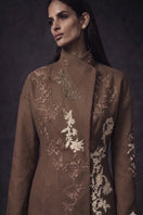 Nadya Shah brown Halycon wrap collar jacket displayed on a hanger, showcasing its stylish design and soft fabric.