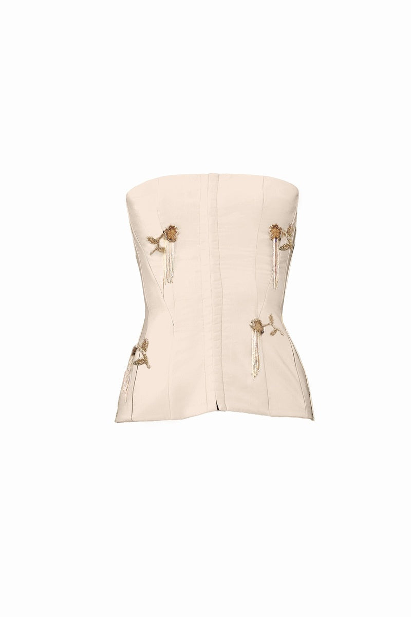White flare corset top by YASSMIN SALEH featuring a fitted bodice and stylish flare design, perfect for trendy fashion looks.