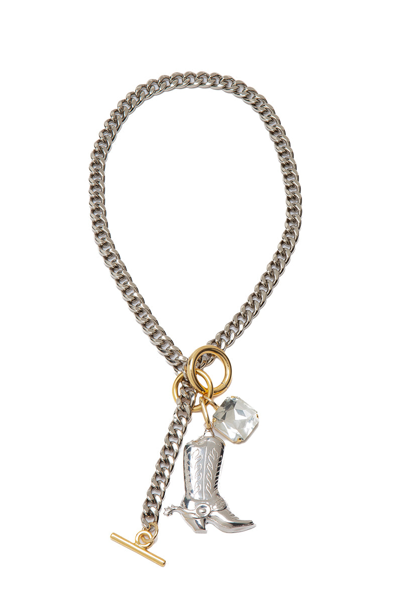 Silvia Gnecchi Debut Necklace featuring a delicate chain with elegant pendant, styled on a neutral background.