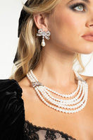 Nana Jacqueline Maxine Necklace showcasing a delicate gold chain with elegant pendant detail on a neutral background.