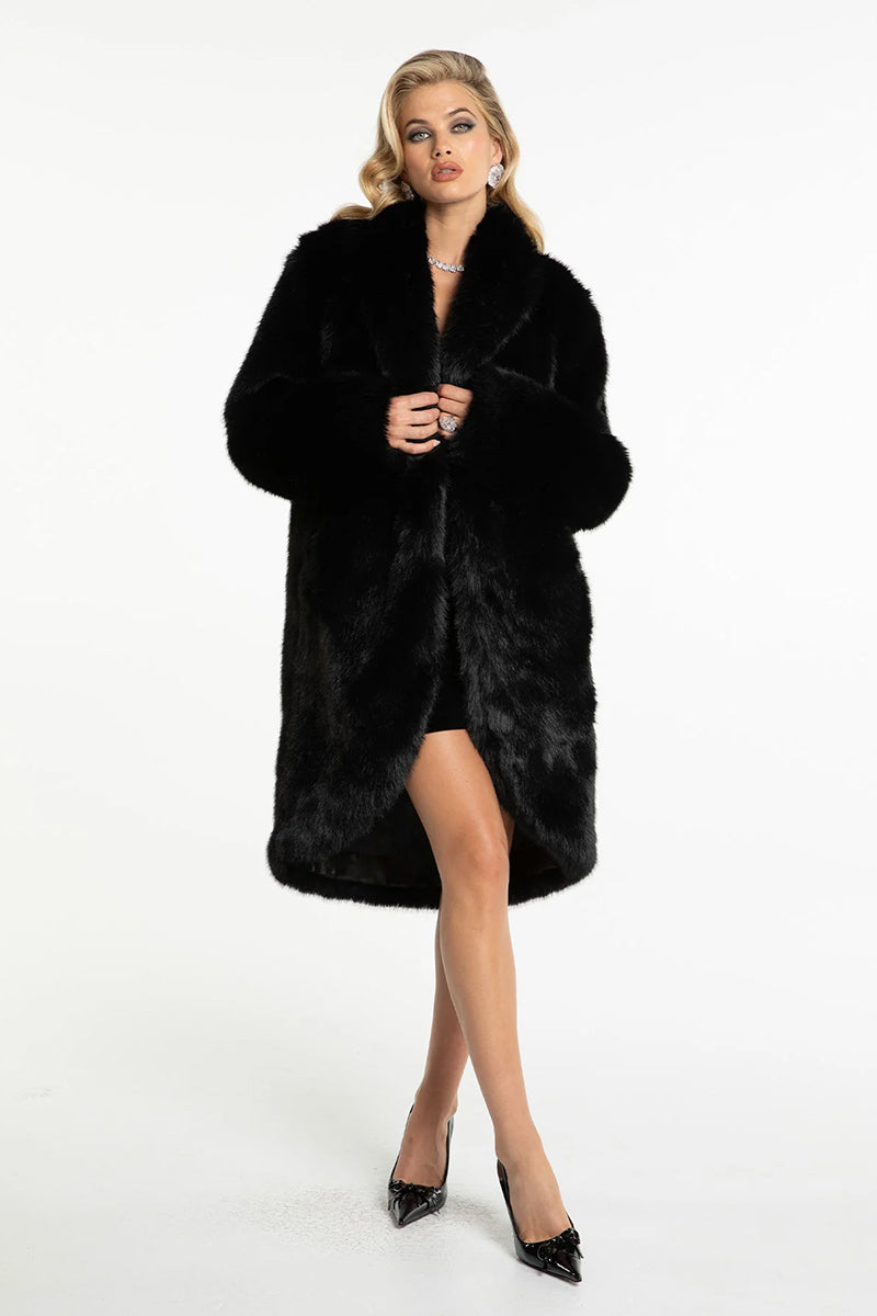 Black Sofia fur coat by Nana Jacqueline featuring plush fur texture and classic silhouette, displayed on a hanger.