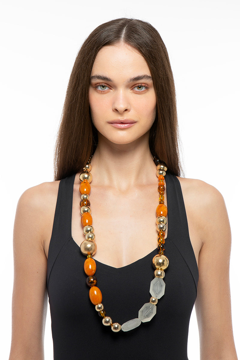 Silvia Gnecchi Coralie long necklace with layered gold chains and delicate pendant, stylish jewelry accessory.