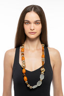 Silvia Gnecchi Coralie long necklace with layered gold chains and delicate pendant, stylish jewelry accessory.
