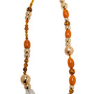 Silvia Gnecchi Coralie long necklace featuring layered gold chains with delicate pendant details.
