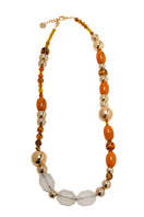 Silvia Gnecchi Coralie long necklace featuring layered gold chains with delicate pendant details.