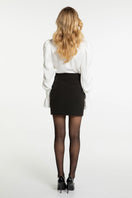 Nana Jacqueline Elsa Top in soft ecru color, lightweight fabric, with a relaxed fit and stylish neckline.