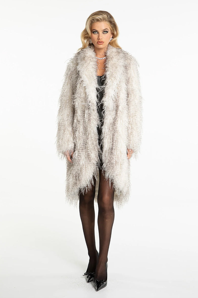 Nana Jacqueline Sofia fur pattern coat displayed on a hanger, showcasing its stylish design and luxurious fur pattern.