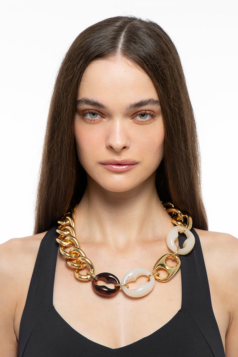Silvia Gnecchi Polina Necklace featuring delicate chain and elegant pendant, displayed on a neutral background.