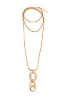 Silvia Gnecchi Bella in Gold and Rice Color necklace featuring delicate gold chain and rice-shaped pendant on a neutral background.