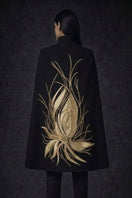 Nadya Shah Cape Solaris jacket in noir, stylish black outerwear with a sleek design and modern silhouette.