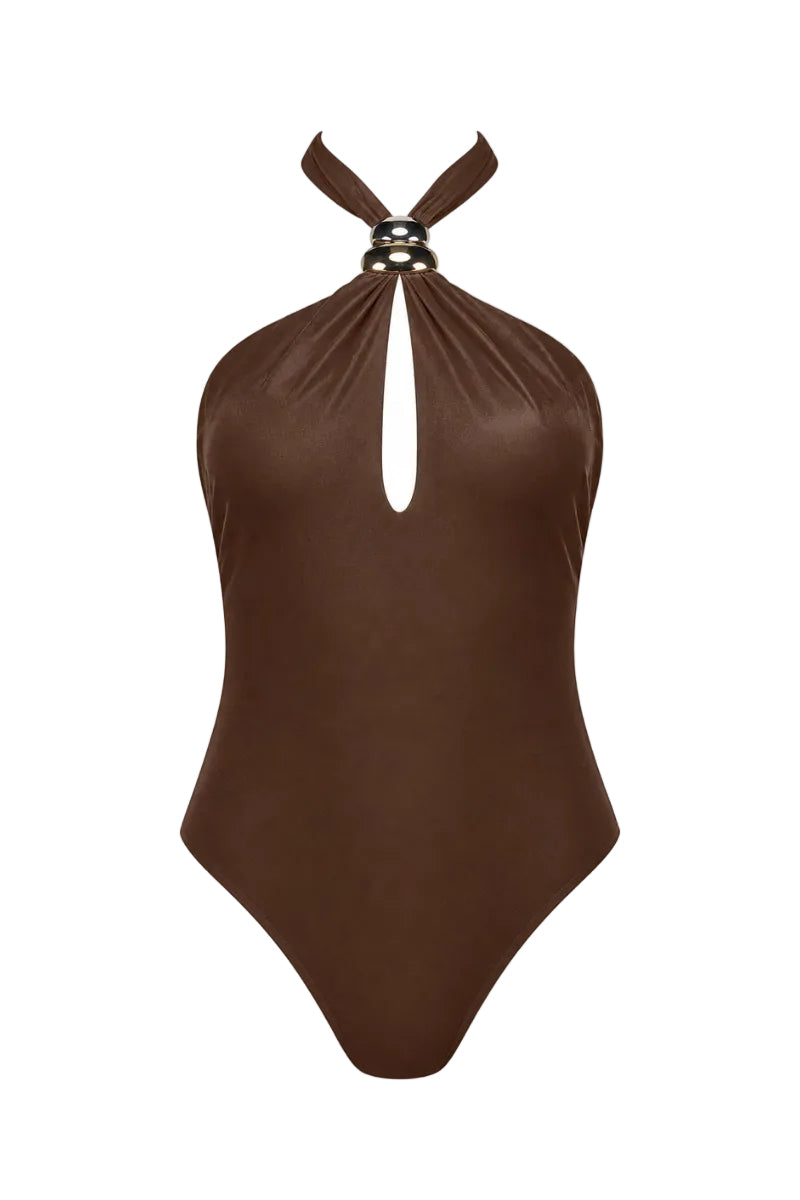 Maliluha Voyage one-piece swimsuit in brown, showcasing a sleek design and comfortable fit on a model.