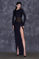 Black slit corset waist gown by CEM featuring a fitted bodice, flowing skirt, and elegant slit design.