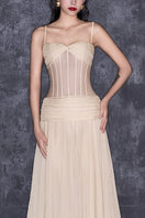 CEM nude chiffon maxi gown with a corset-style bodice and extra long flowing skirt, elegant formal dress for special occasions