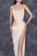 Strapless cream chiffon gown by CEM featuring a fitted corset bodice and flowing skirt, elegant formal evening dress.