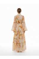 BY HAÓ Lucienne tiered maxi dress in multi-colored fabric, flowing design with ruffled layers and long sleeves.