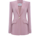 Pink Wiesbaden jacket by Lekieu displayed on a hanger with a front view showing its stylish design and vibrant color.