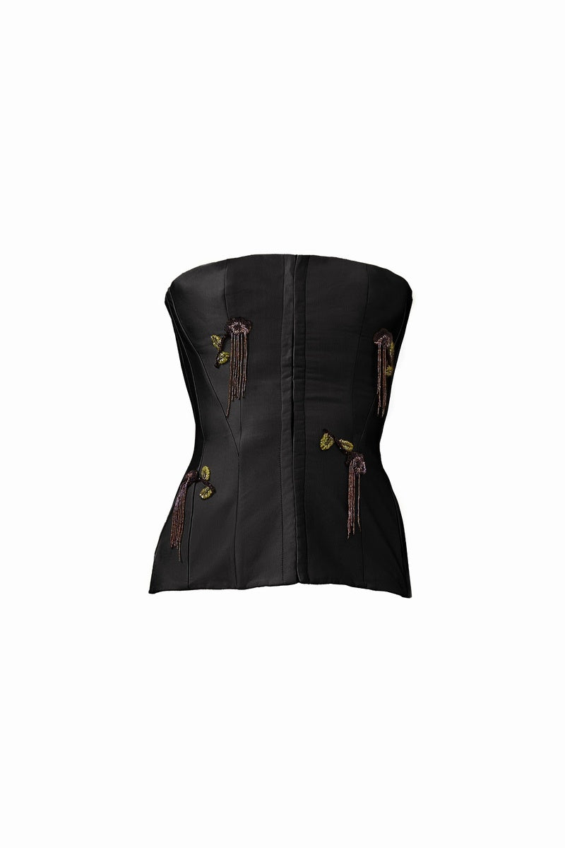 Black flare corset top by YASSMIN SALEH featuring fitted design and stylish flare details, displayed on a mannequin.