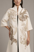 Nadya Shah Belle Epoque ivory coat featuring elegant vintage-inspired design and tailored fit displayed on a mannequin.