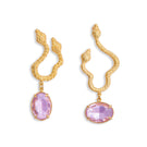 Asymmetric snake earrings by Natia x Lako with light pink crystal accents, featuring a bold, modern jewelry design.