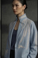 Nadya Shah Skyelar denim blouson in powder-blue denim jacket with relaxed fit and button-front design.