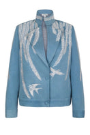 Nadya Shah Skyelar denim blouson in powder-blue denim jacket with relaxed fit and classic collar, shown on a hanger.