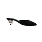 Black YASSMIN SALEH Orbit heels featuring sleek design and pointed toes, displayed on a neutral background.