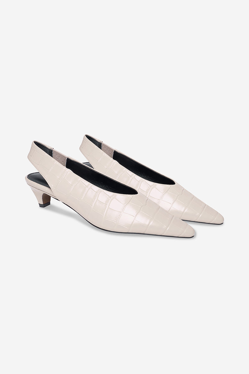 Elegant ivory heels from 10th Floor with sleek design, perfect for formal occasions and stylish footwear.