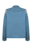 Nadya Shah Skyelar denim blouson in powder-blue denim jacket with button details and relaxed fit, displayed on a hanger.
