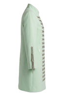 Nadya Shah Azurra Mint Coat in soft mint color, tailored coat with a sleek design and button details, displayed on a hanger.