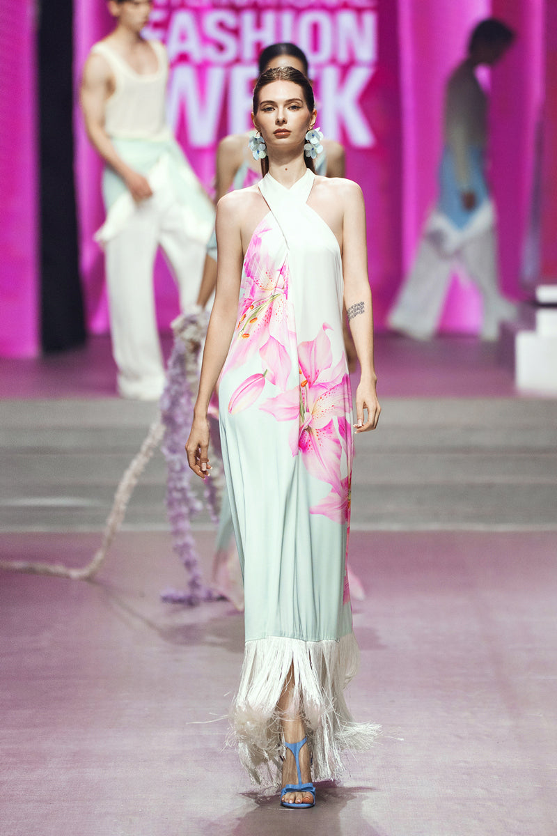 Colorful Valenciani Riviera halter maxi dress with a vibrant multicolor pattern, flowing fabric, and halter neckline.
