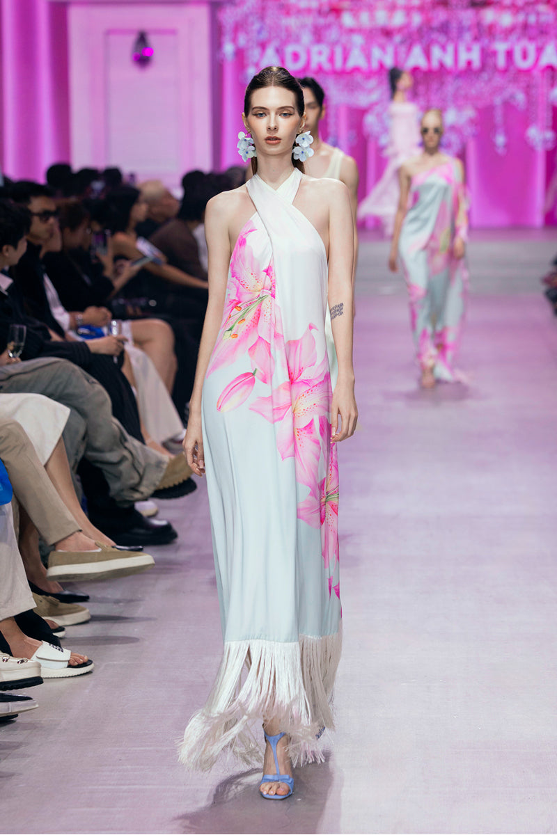Valenciani Riviera halter maxi dress in multicolor with flowing fabric and vibrant pattern, perfect for summer or special occasions.
