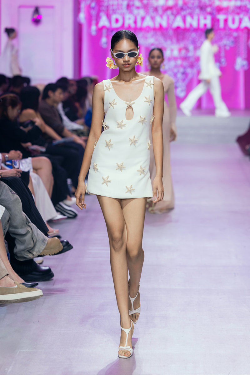 Valenciani ivory starfish mini dress featuring a fitted silhouette and stylish design, perfect for summer or casual occasions.