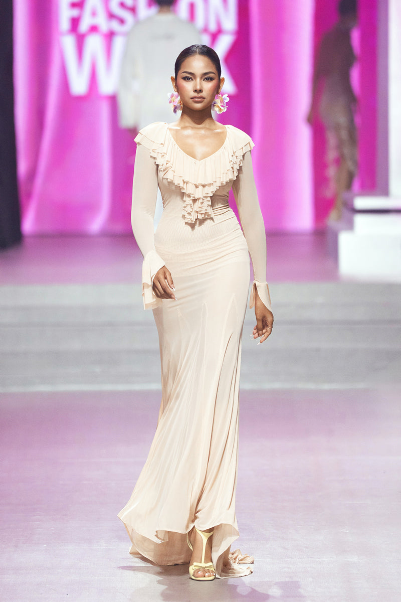 Valenciani CULT MIA X VALENCIANI The Seraphina maxi dress, flowy fabric, elegant design, worn by a model in a fashion photoshoot.