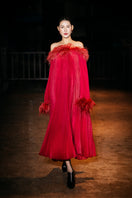 Red Valenciani midi dress with ostrich feather trim and pleated design, showcasing elegant fabric and sophisticated style.