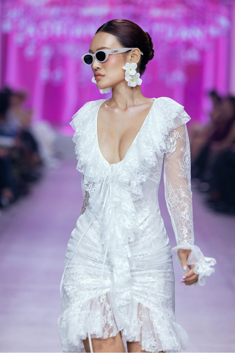 White Seraphina Ruffle High-Low Midi Dress by Valenciani, featuring elegant ruffle details and a flowing high-low hem.