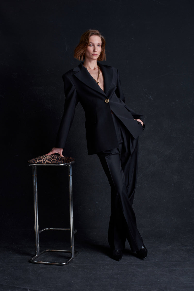 Black Earth Blazer jacket by Acaria Studio, styled with its tailored fit and sleek design, shown on a model.