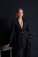 Black Earth Blazer jacket by Acaria Studio, featuring tailored fit and stylish design, shown on a model.