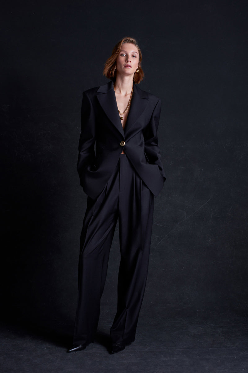 Black Earth Blazer jacket by Acaria Studio, featuring a tailored fit and stylish design, shown on a model.