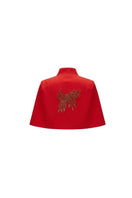 Nadya Shah Cape Éclat in Rouge, stylish red jacket with elegant drape, shown on a hanger against a neutral background.
