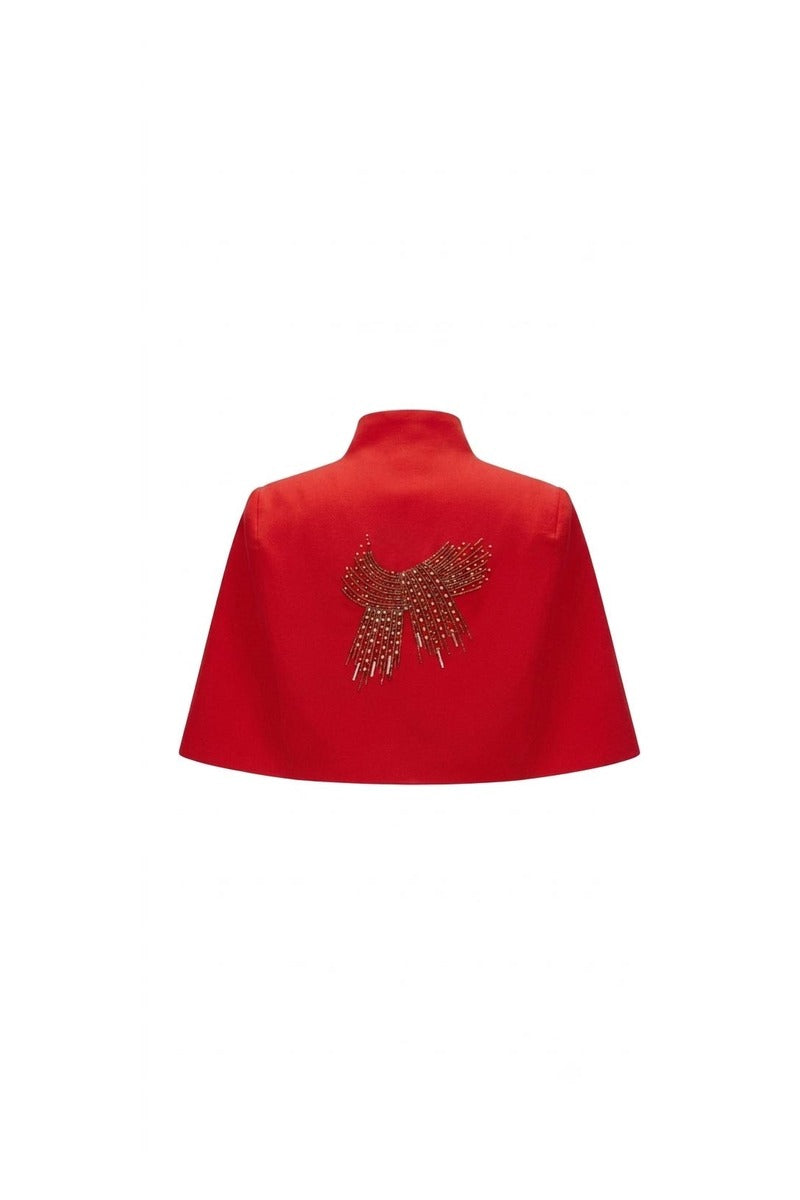 Nadya Shah Cape Éclat in Rouge, stylish red jacket with elegant drape, shown on a hanger against a neutral background.