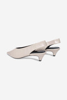 Pair of ivory Downtown heels by 10th Floor featuring sleek design and pointed toes, perfect for elegant dressy occasions.