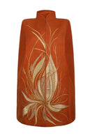 Nadya Shah Cape Solaris in Solar Amber jacket showcasing a stylish, lightweight design with warm solar amber color.