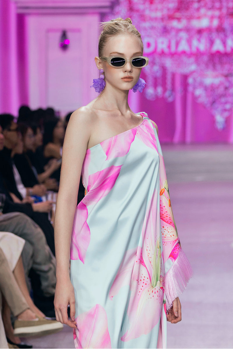 Valenciani multicolor one-shoulder maxi dress featuring flowing fabric and vibrant patterns, perfect for elegant summer events.