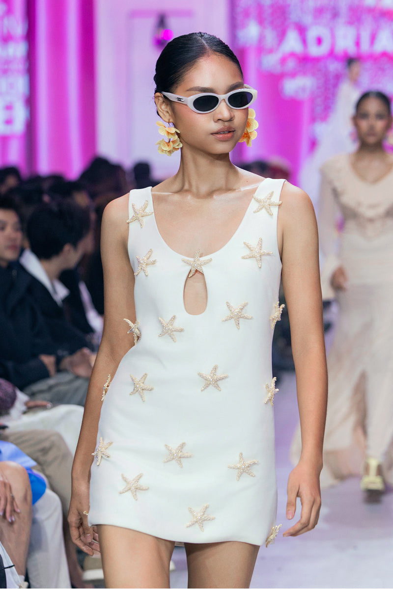 Valenciani Starfish mini dress in ivory, featuring a stylish sleeveless design and fitted silhouette, ideal for summer occasions.