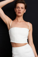White Ancient Top by Acaria Studio, featuring a stylish, lightweight design perfect for casual or layered outfits.